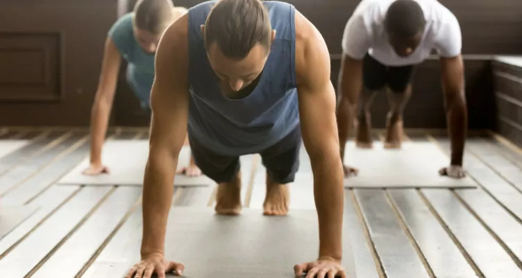 Group of people doing plank pose